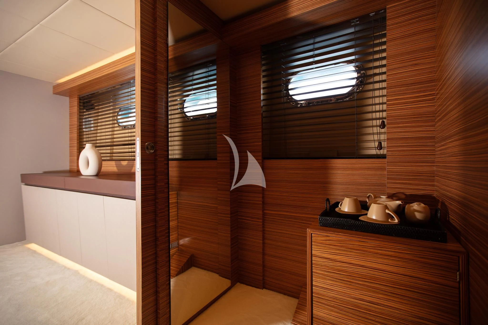 a room with a table and a window aboard GIOE I Yacht for Sale