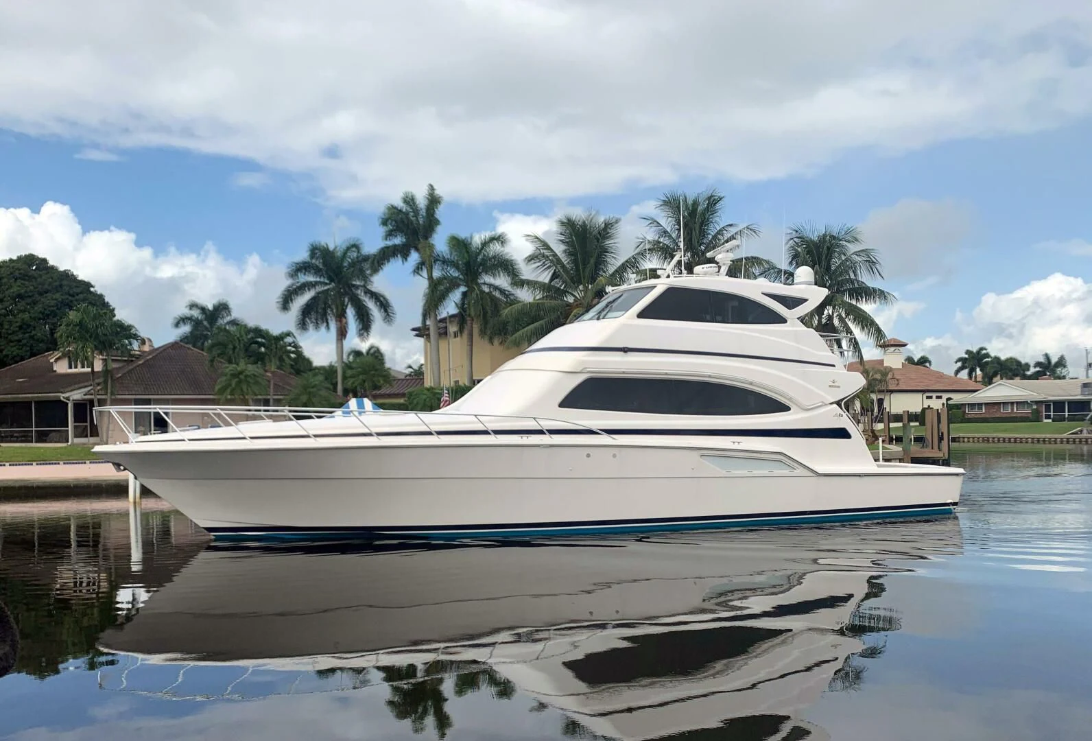 a white yacht on the water aboard REEL BUSY Yacht for Sale