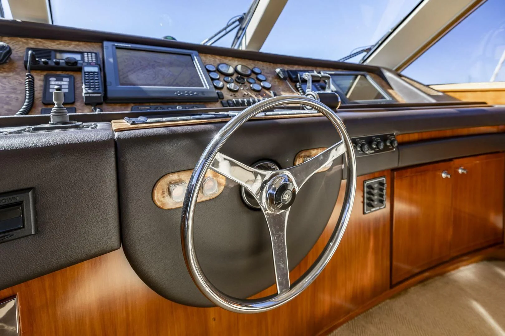 a car with a steering wheel aboard REEL BUSY Yacht for Sale