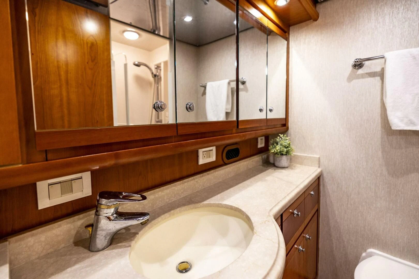 a bathroom with a large mirror aboard REEL BUSY Yacht for Sale