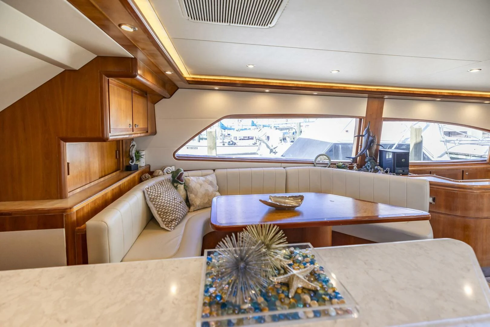 a room with a table and chairs aboard REEL BUSY Yacht for Sale