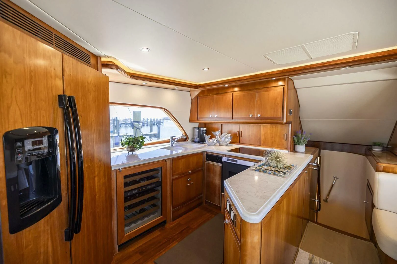 a kitchen with wooden cabinets aboard REEL BUSY Yacht for Sale