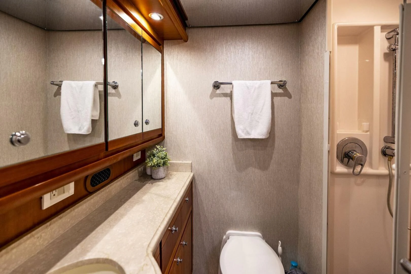 a bathroom with a large mirror aboard REEL BUSY Yacht for Sale