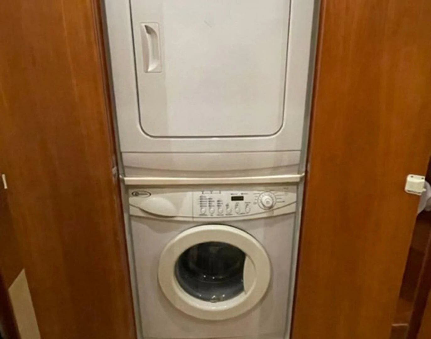 a washing machine in a closet aboard REEL BUSY Yacht for Sale