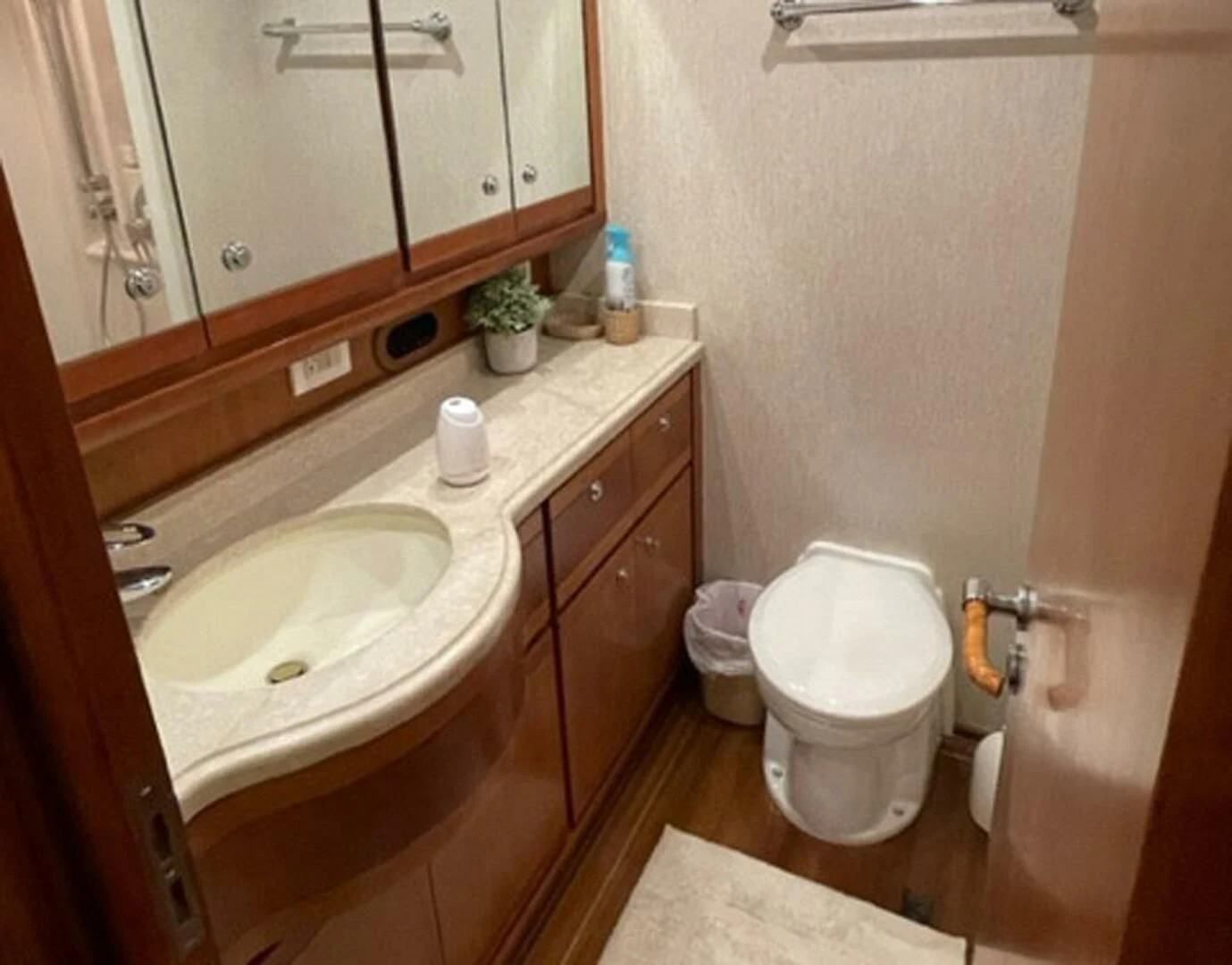 a bathroom with a sink and toilet aboard REEL BUSY Yacht for Sale