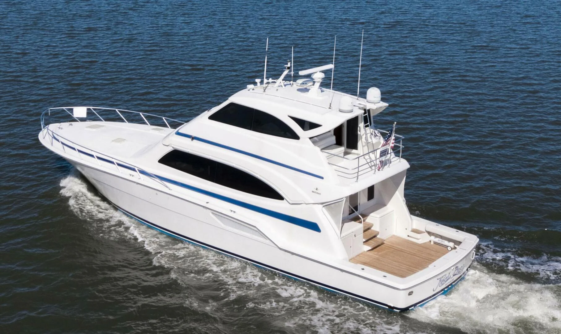 a white boat on the water aboard REEL BUSY Yacht for Sale