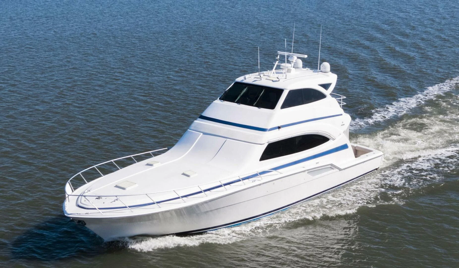 a white yacht in the water aboard REEL BUSY Yacht for Sale