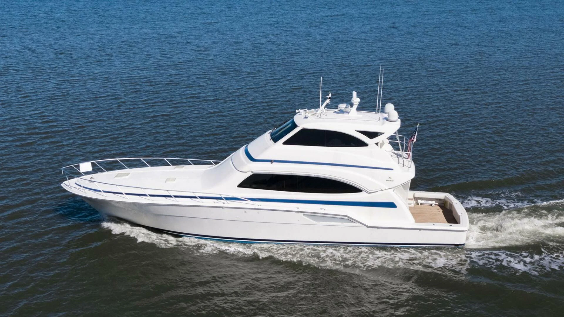 a white yacht on the water aboard REEL BUSY Yacht for Sale