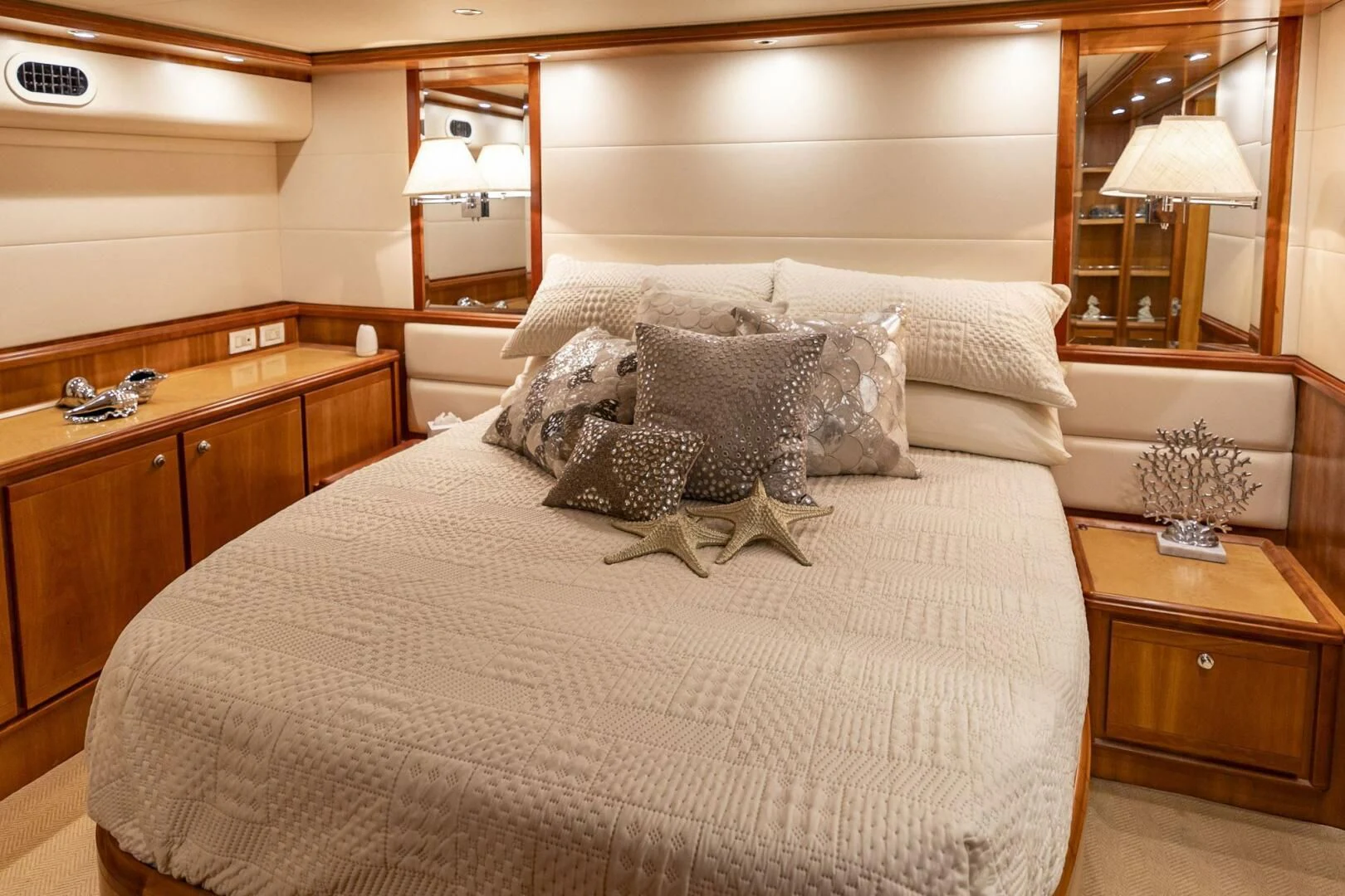 a bed with pillows aboard REEL BUSY Yacht for Sale