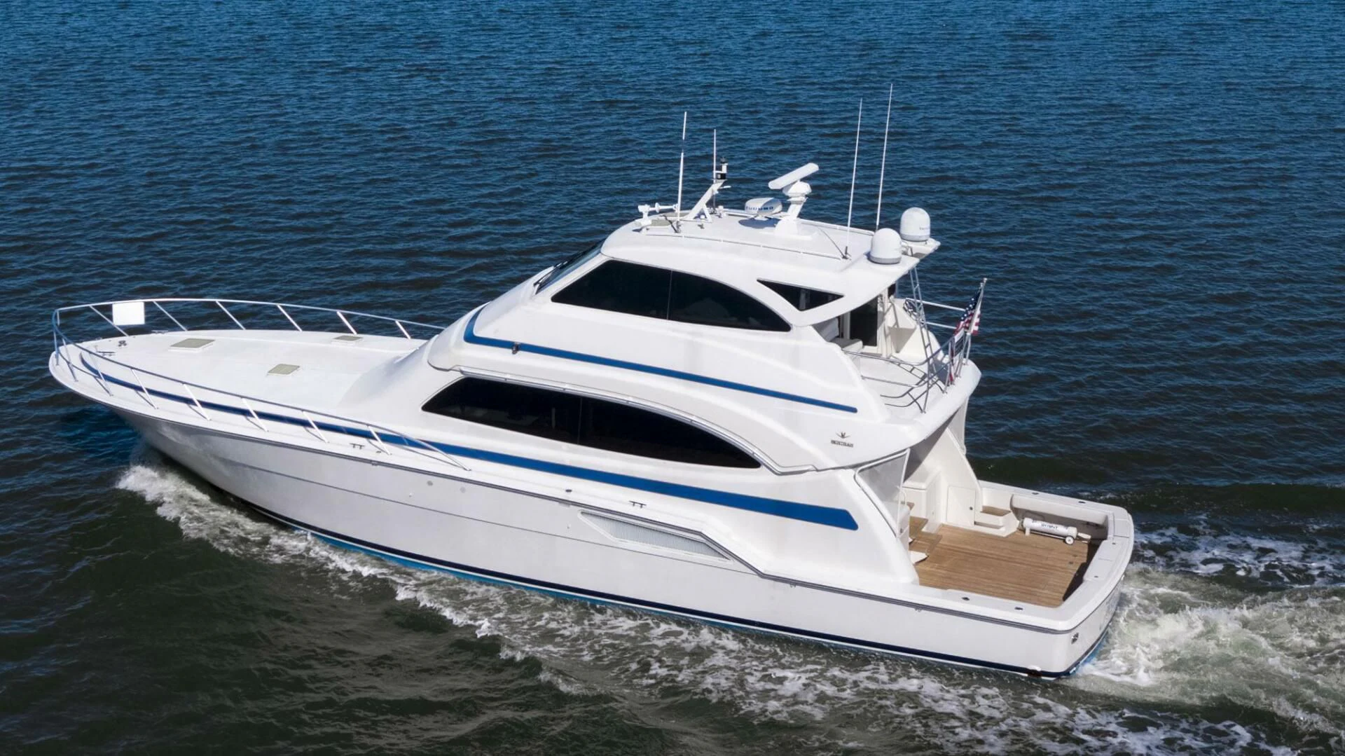 a white boat on the water aboard REEL BUSY Yacht for Sale
