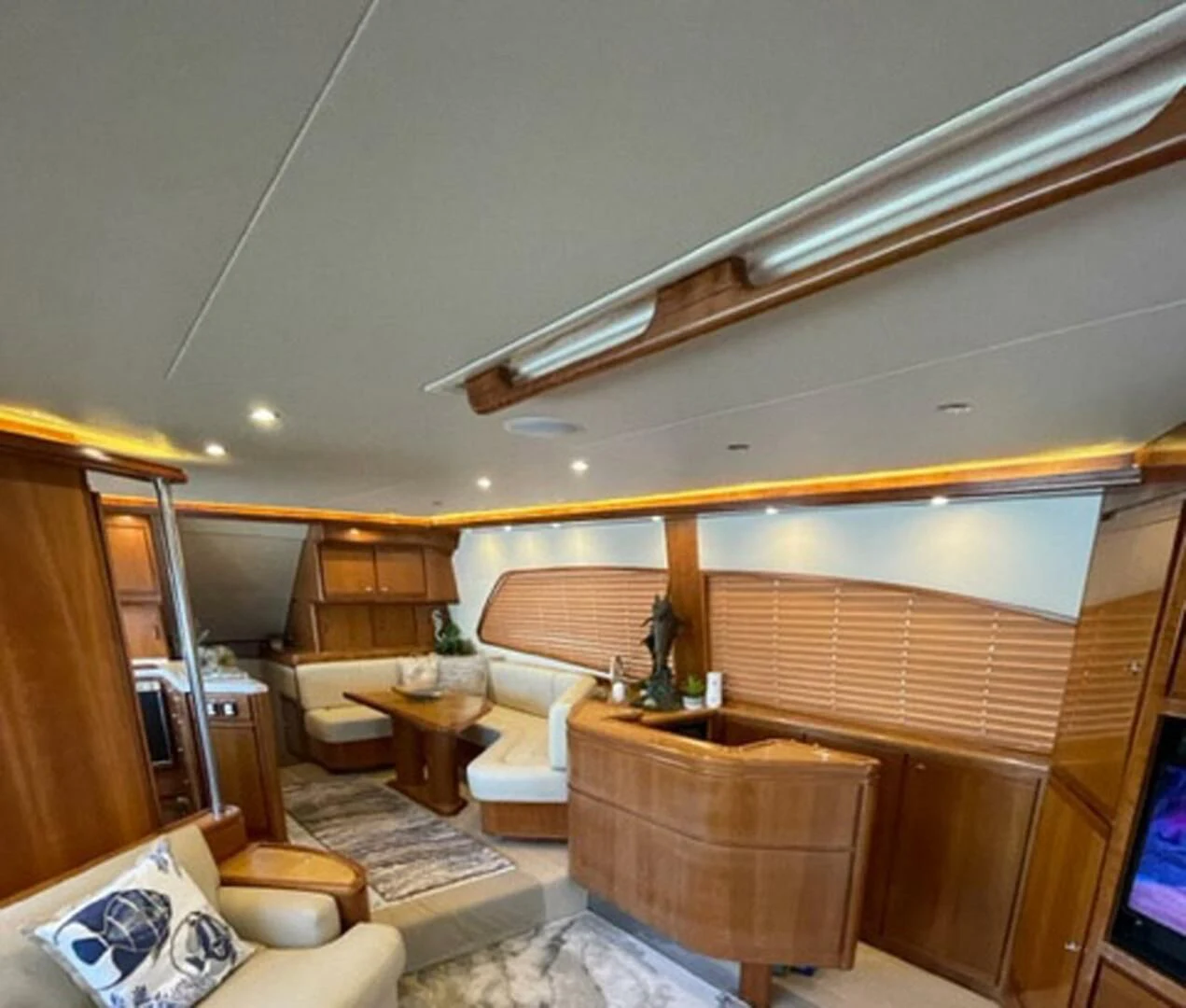 a living room with a wood ceiling aboard REEL BUSY Yacht for Sale
