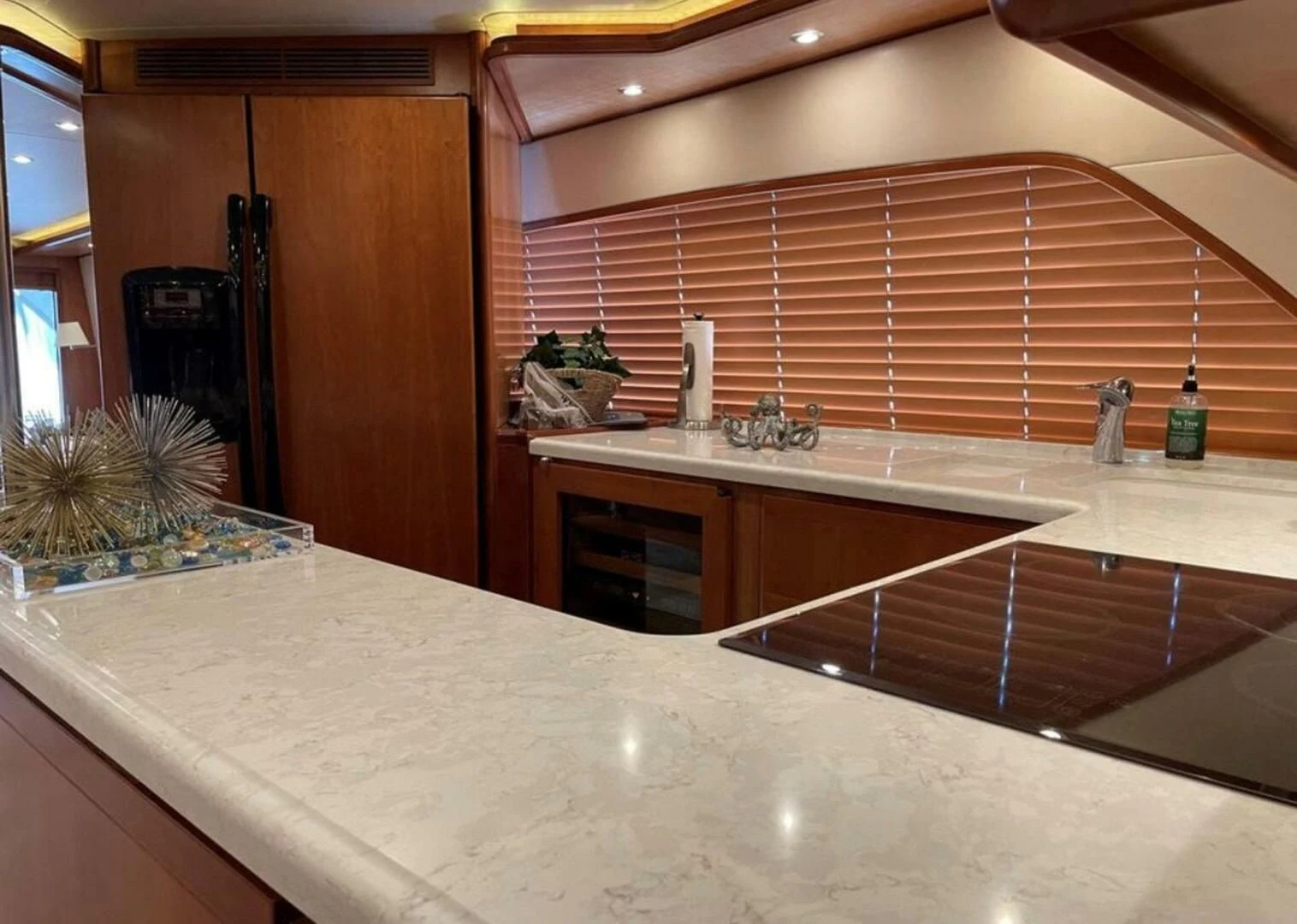 a kitchen with a large island aboard REEL BUSY Yacht for Sale