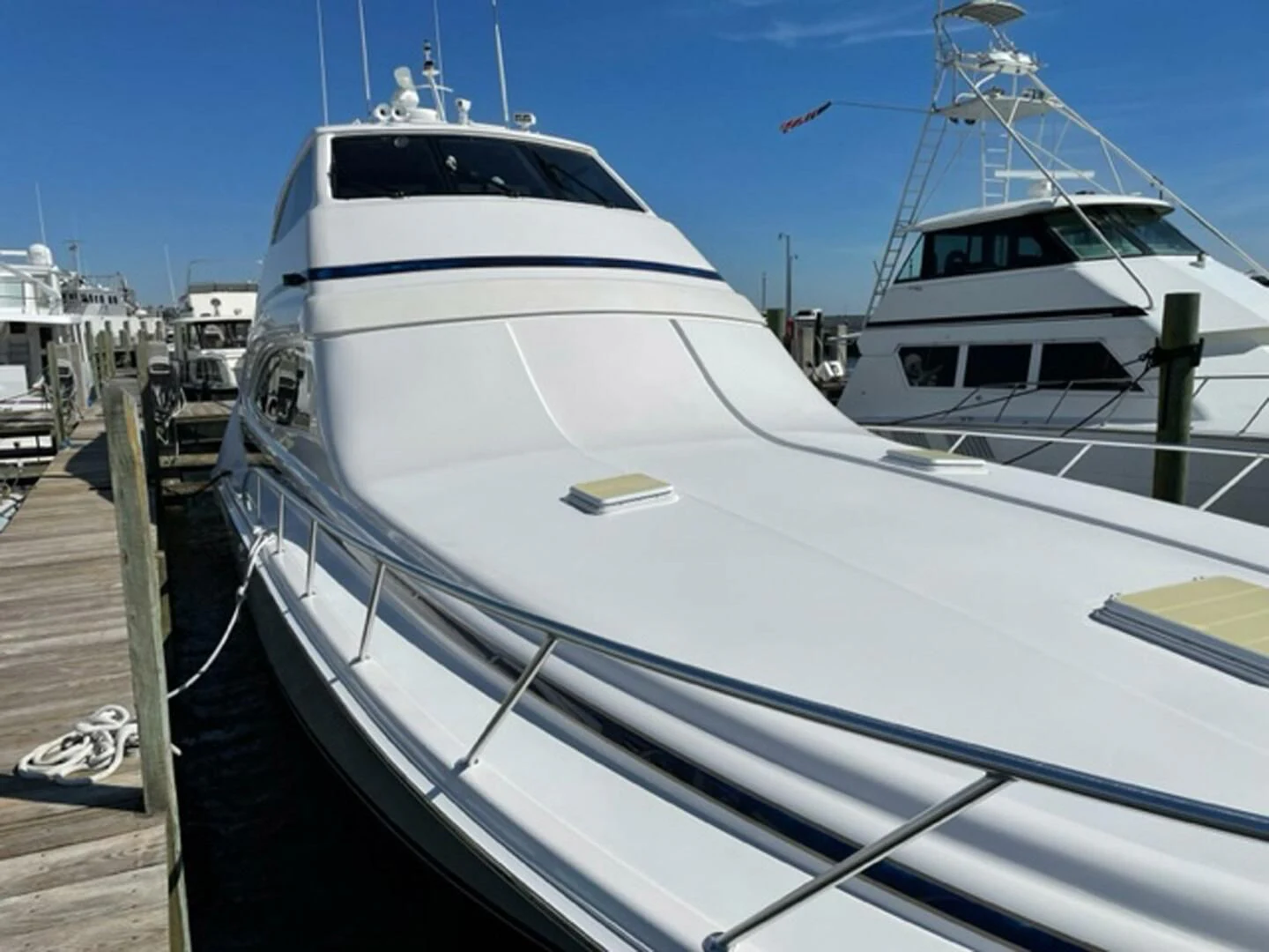 a large white yacht docked aboard REEL BUSY Yacht for Sale