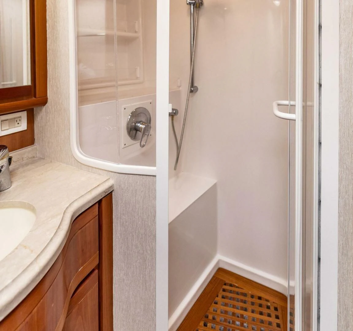 a bathroom with a sink and a shower aboard REEL BUSY Yacht for Sale