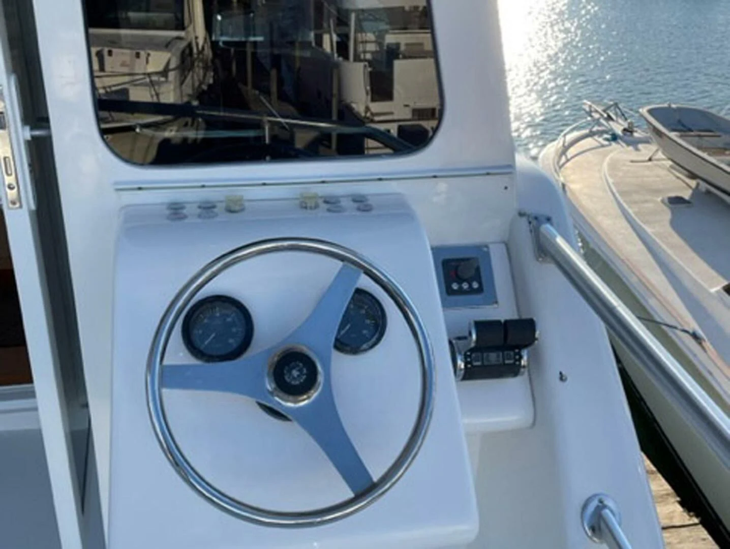 a white speaker on a vehicle aboard REEL BUSY Yacht for Sale