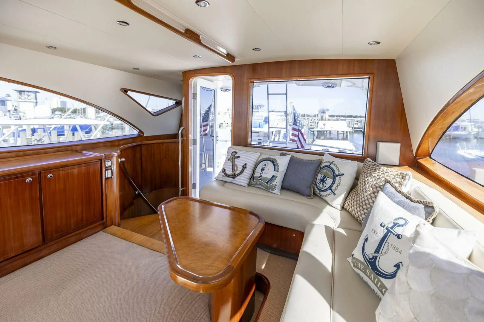 a bedroom with a bed and a chair aboard REEL BUSY Yacht for Sale