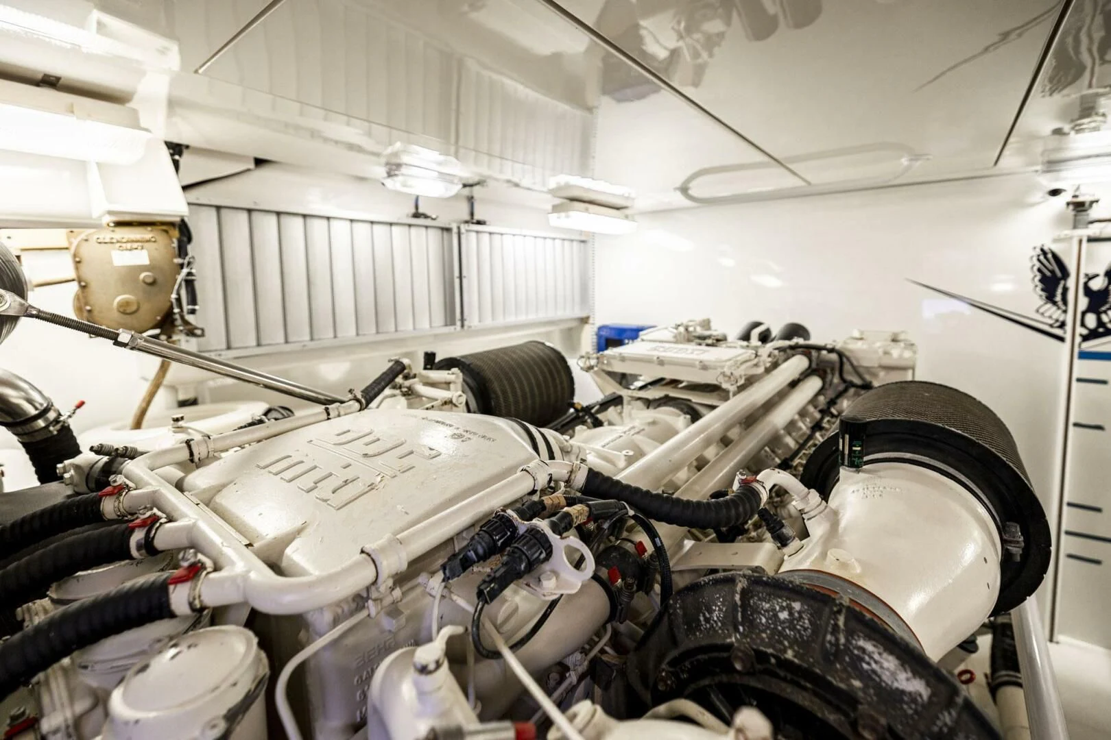 a car with a large engine aboard REEL BUSY Yacht for Sale