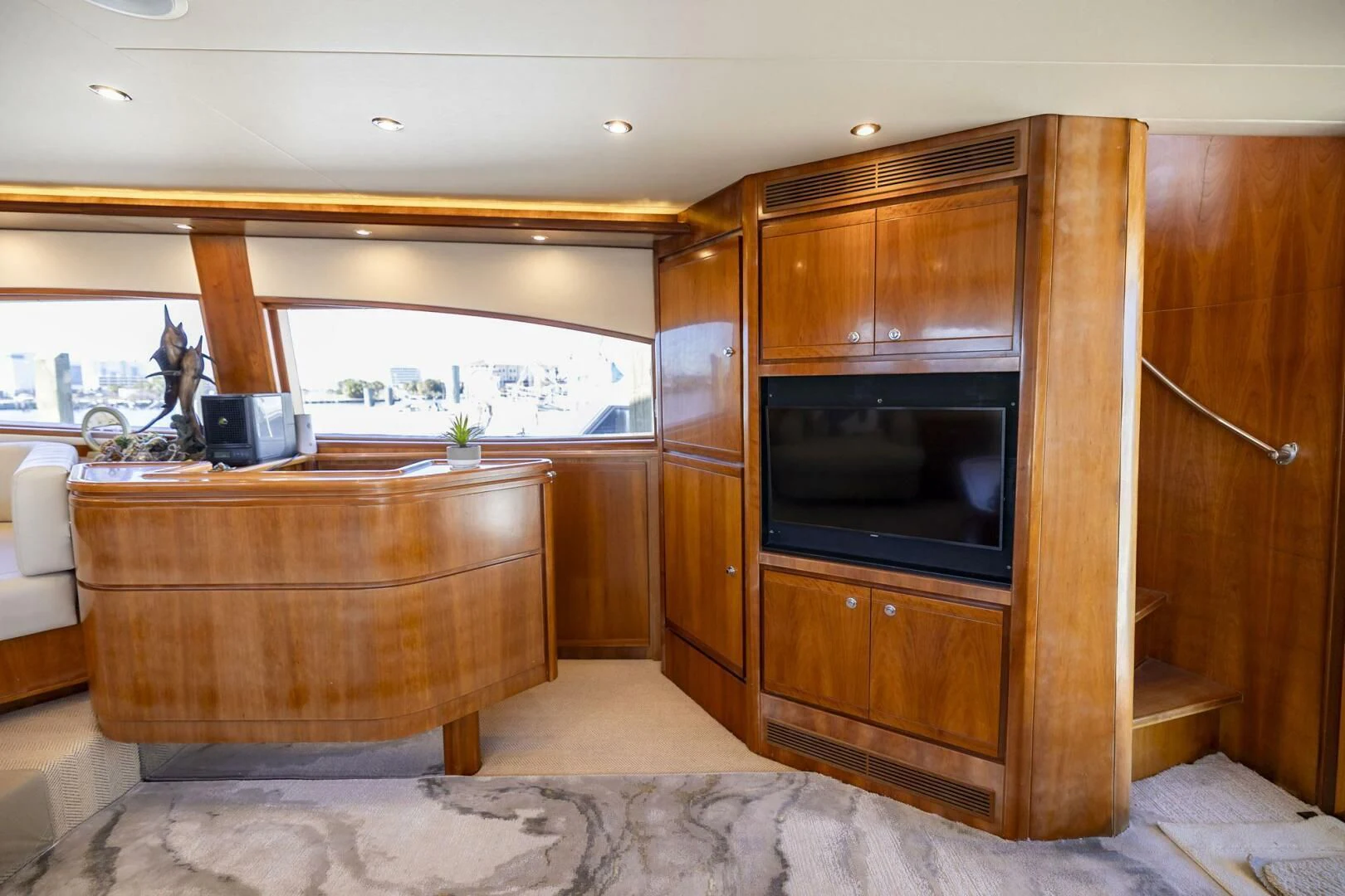 a kitchen with wooden cabinets aboard REEL BUSY Yacht for Sale