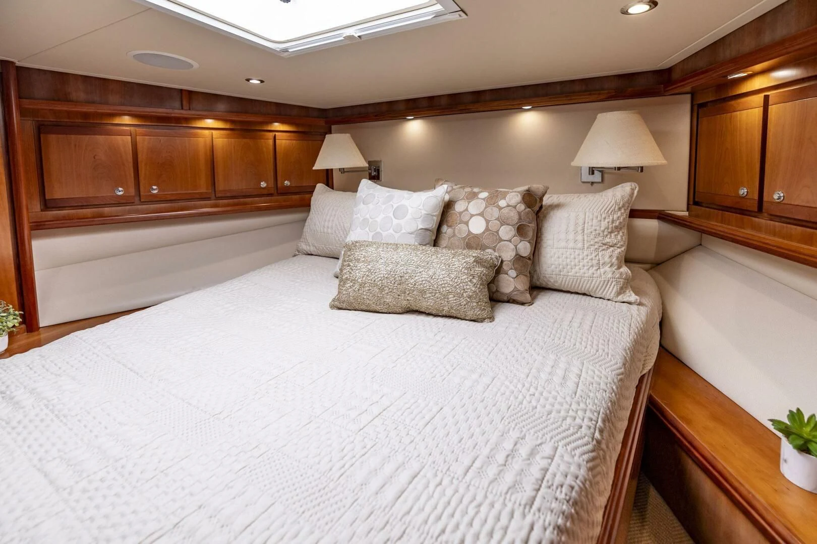 a large bed with pillows aboard REEL BUSY Yacht for Sale