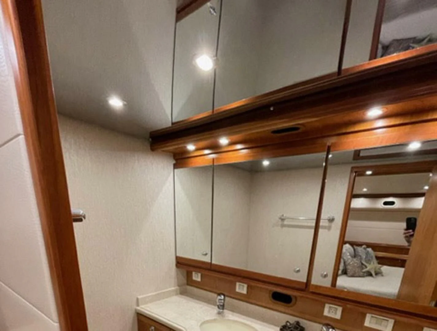 a bathroom with a large mirror aboard REEL BUSY Yacht for Sale