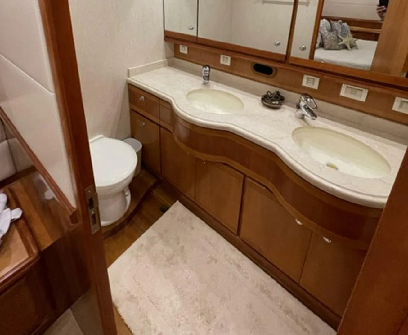 a bathroom with a sink and a toilet aboard REEL BUSY Yacht for Sale