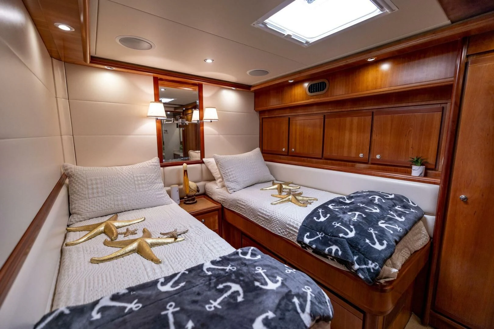a couple of beds in a hotel room aboard REEL BUSY Yacht for Sale