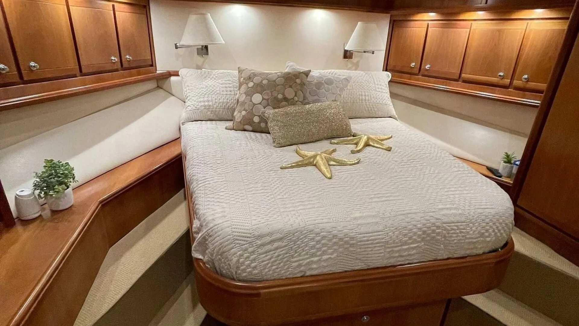 a bed with white sheets aboard REEL BUSY Yacht for Sale