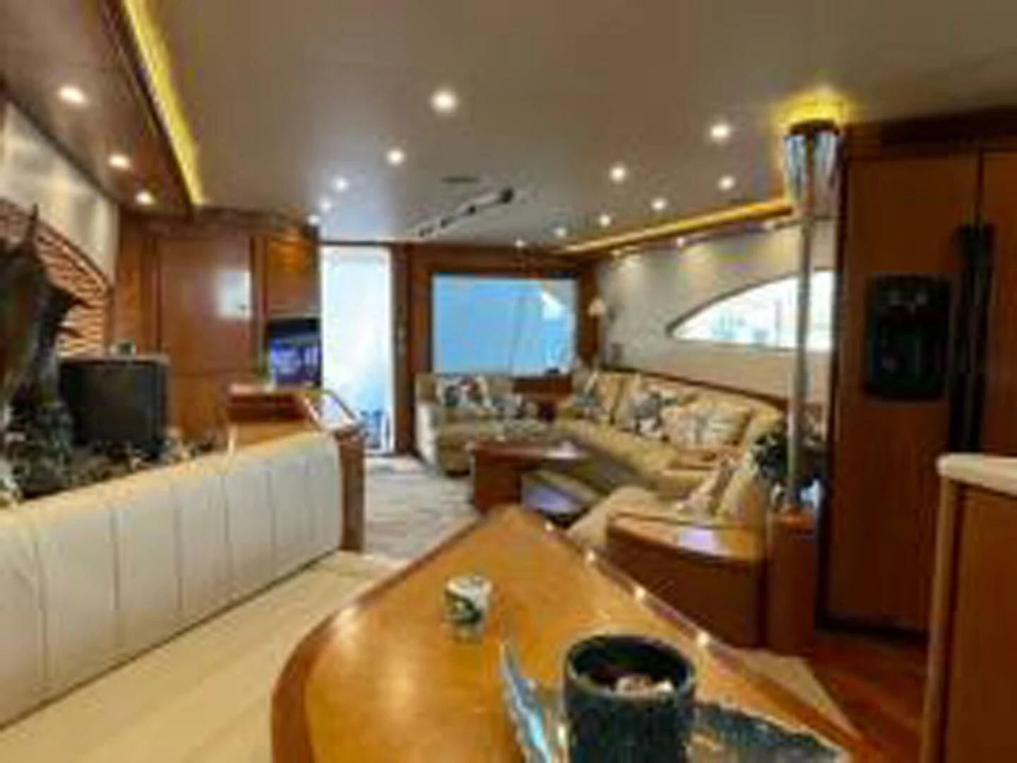 a living room with a large tv aboard REEL BUSY Yacht for Sale