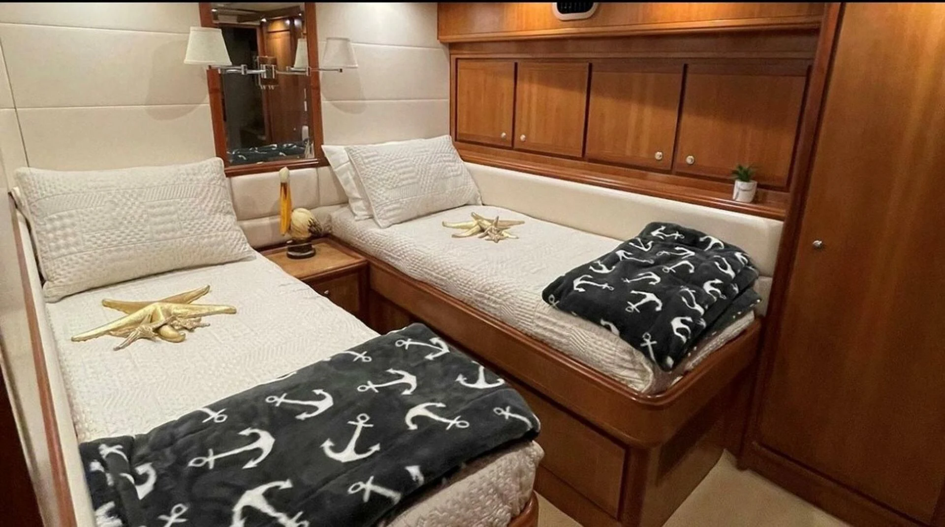 a couple of beds in a room aboard REEL BUSY Yacht for Sale