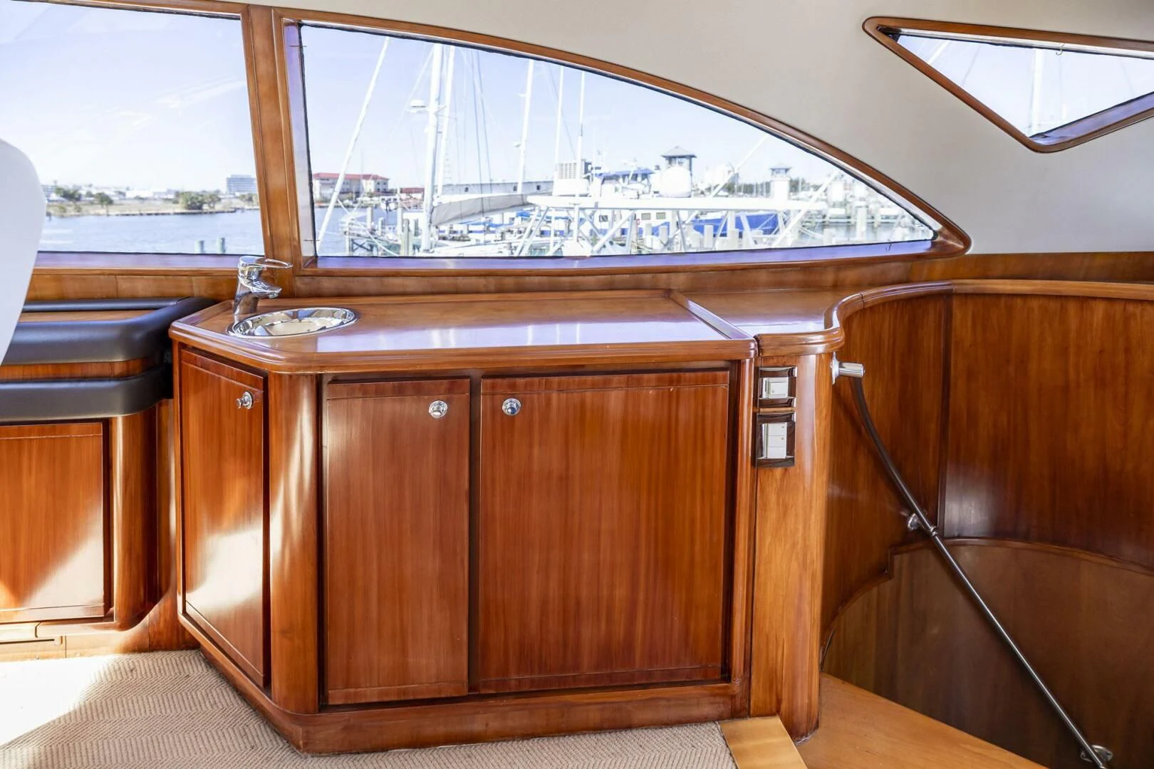 a wooden cabinet in a room aboard REEL BUSY Yacht for Sale