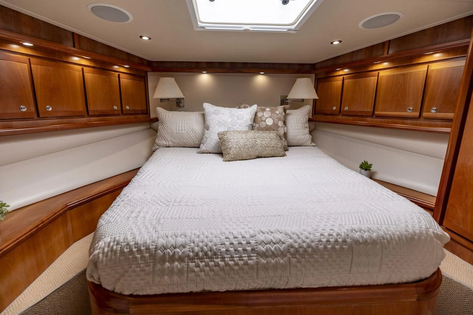 a bed with white sheets aboard REEL BUSY Yacht for Sale