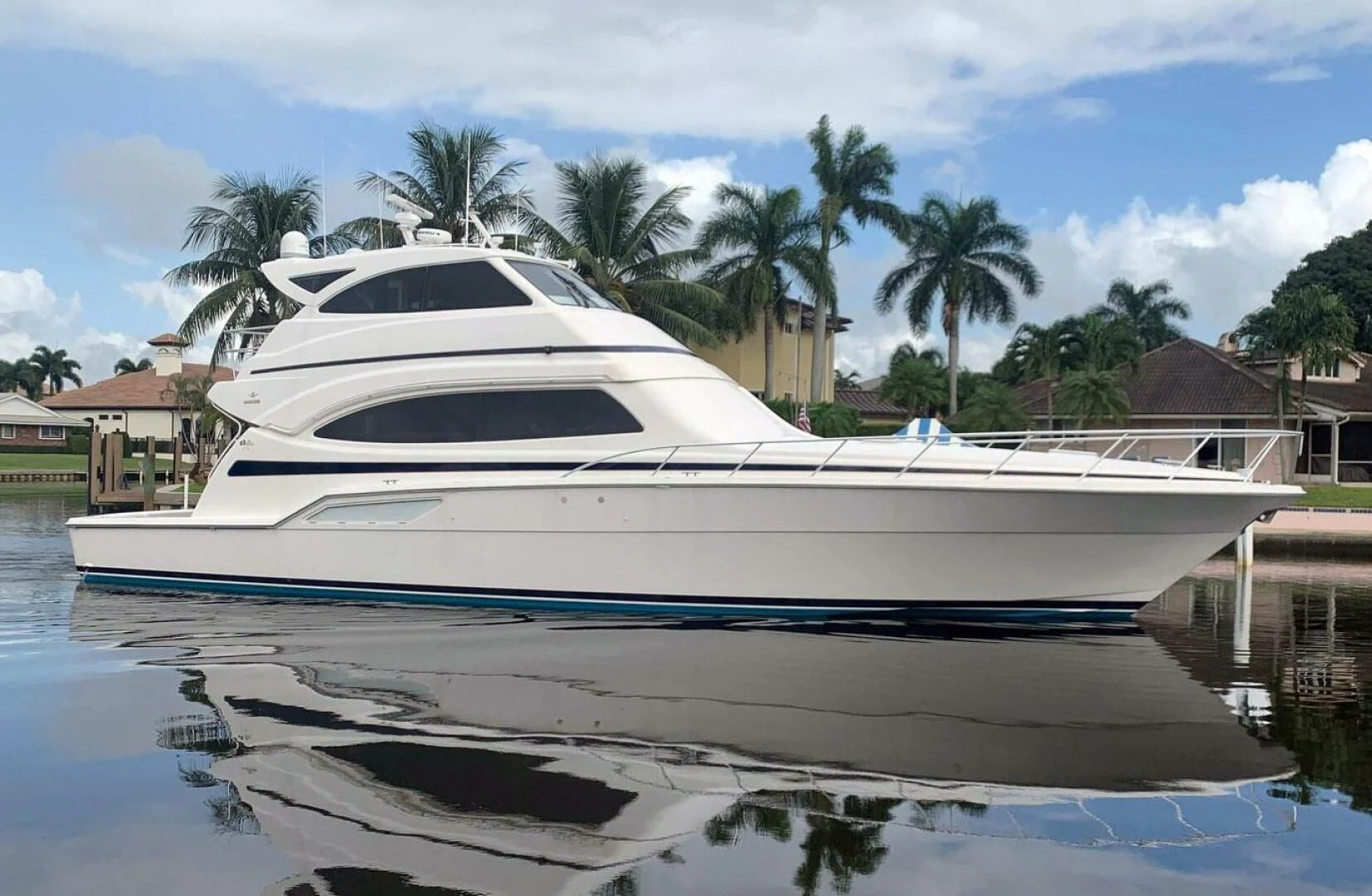 a white yacht in a body of water aboard REEL BUSY Yacht for Sale