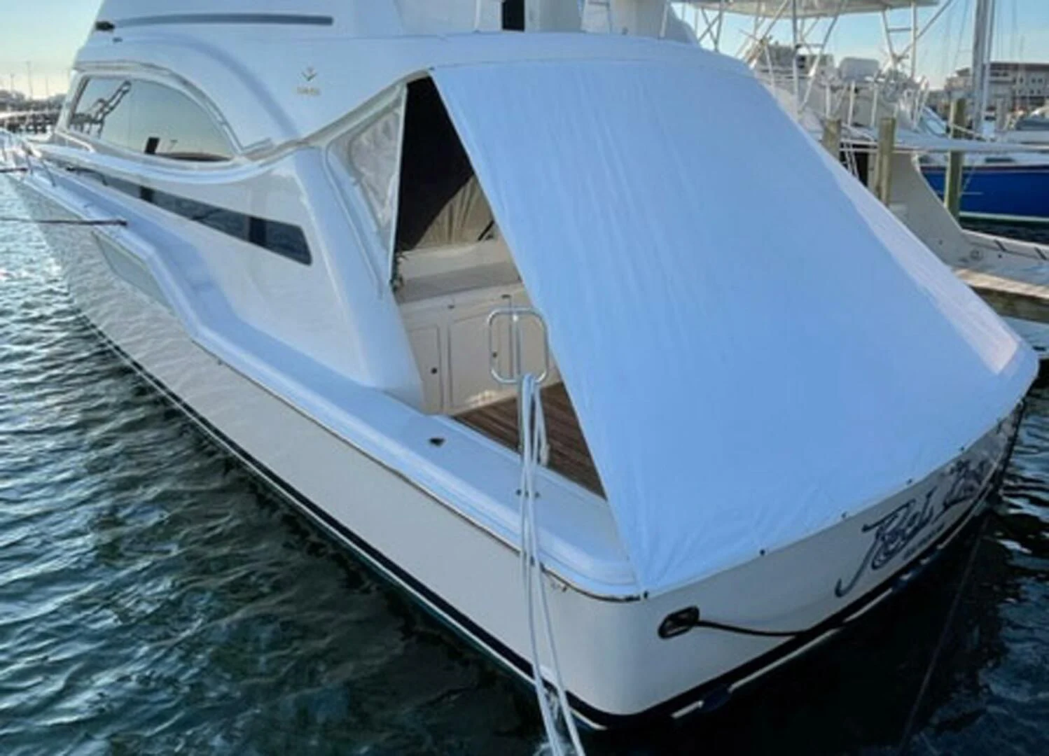 a white boat on the water aboard REEL BUSY Yacht for Sale