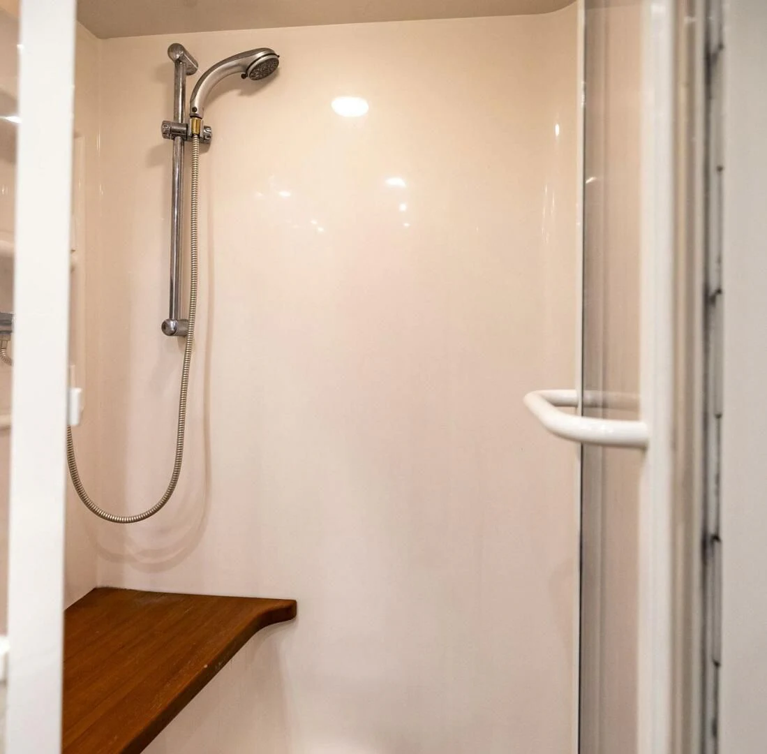 a shower head with a white wall aboard REEL BUSY Yacht for Sale