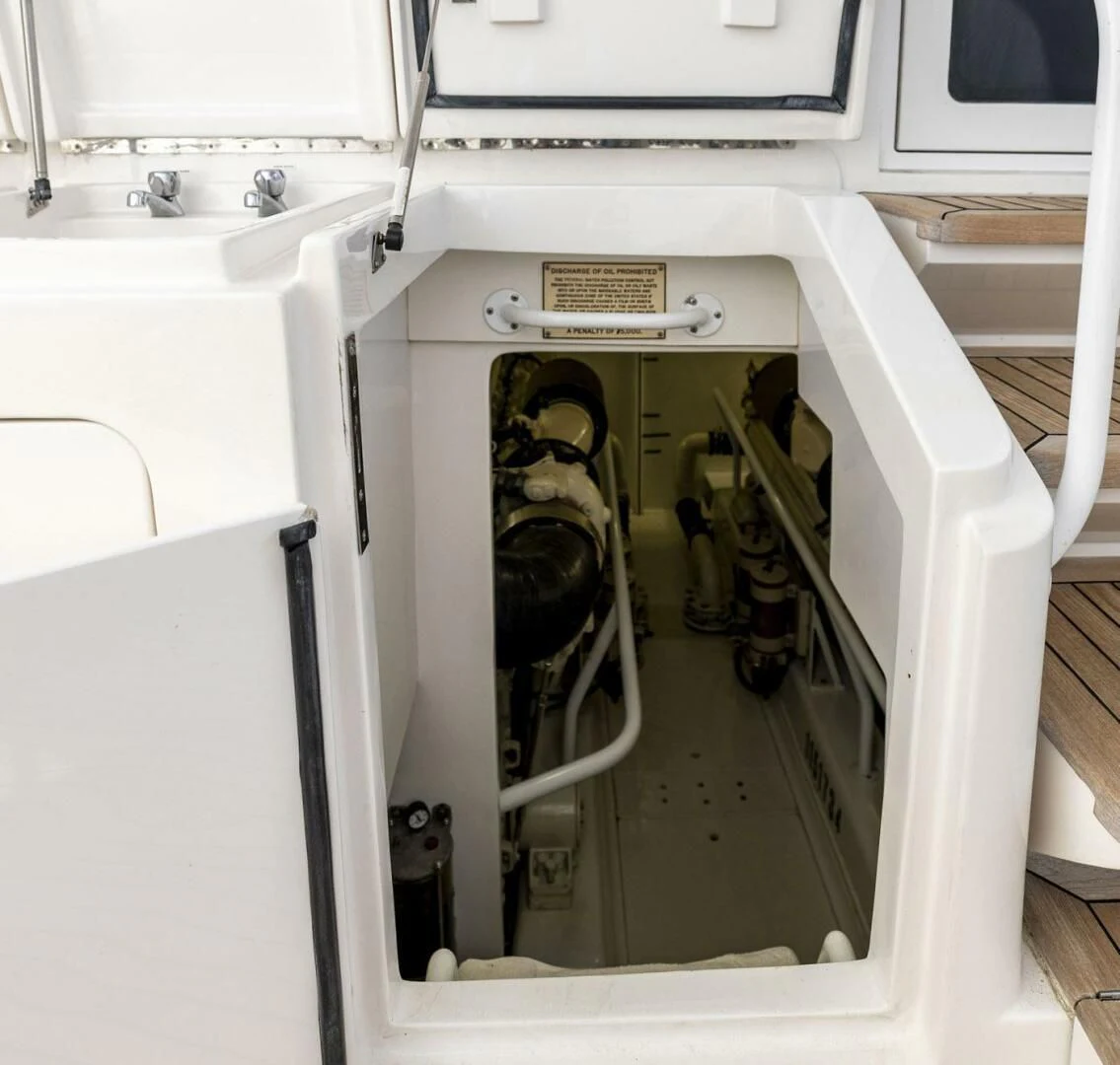 a white cabinet with a door open aboard REEL BUSY Yacht for Sale