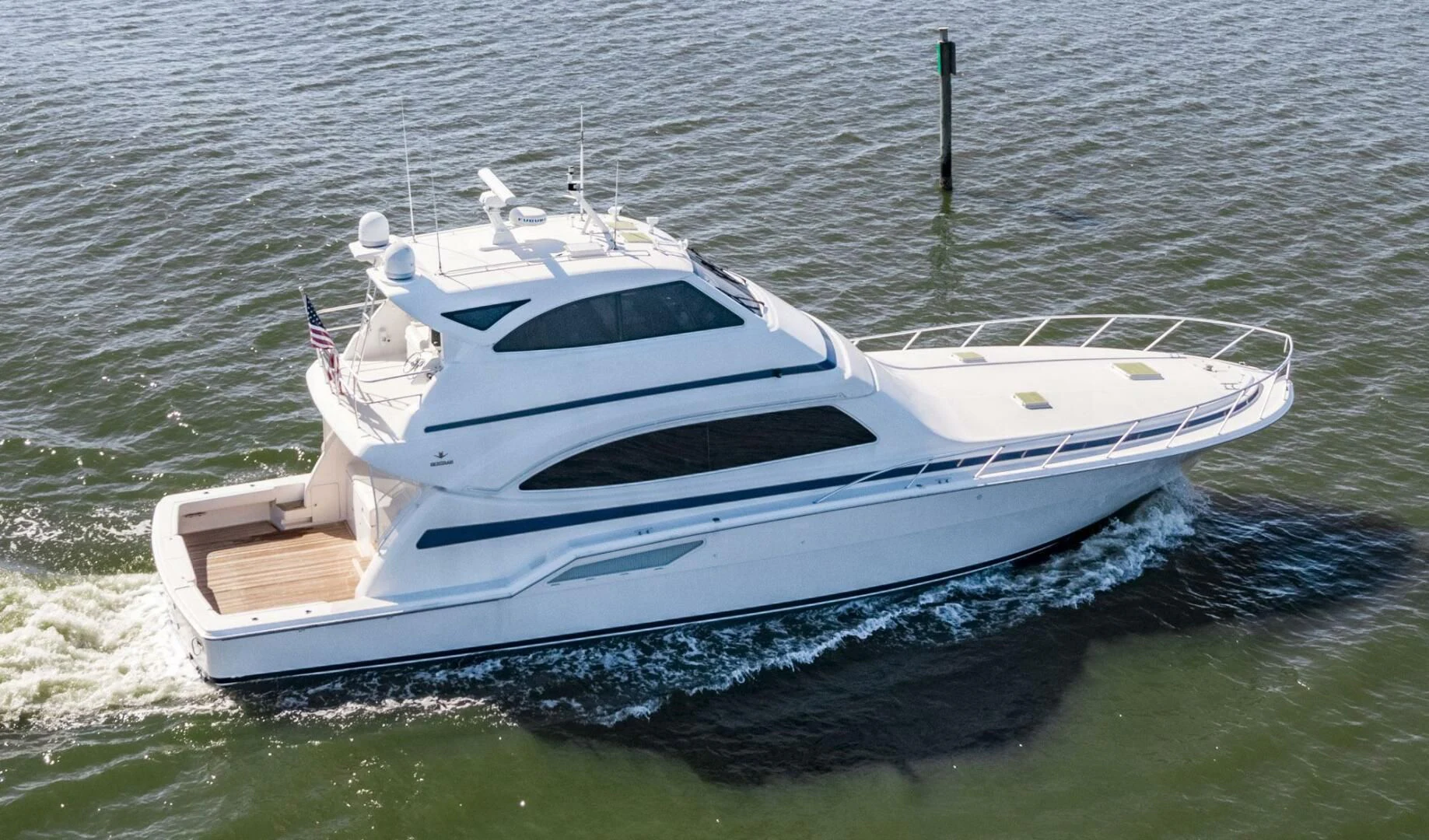 a white boat in the water aboard REEL BUSY Yacht for Sale