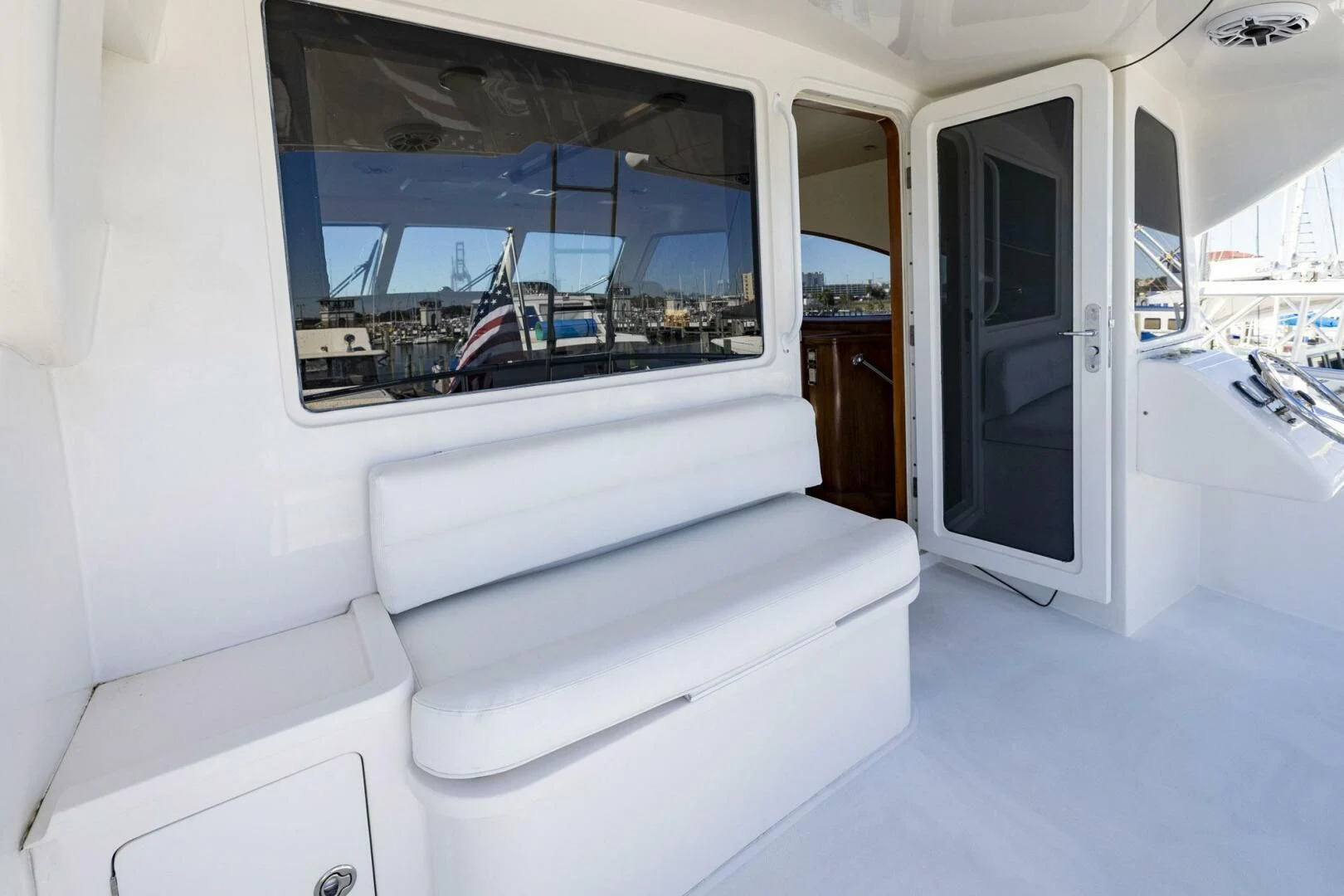 a white couch in a room aboard REEL BUSY Yacht for Sale
