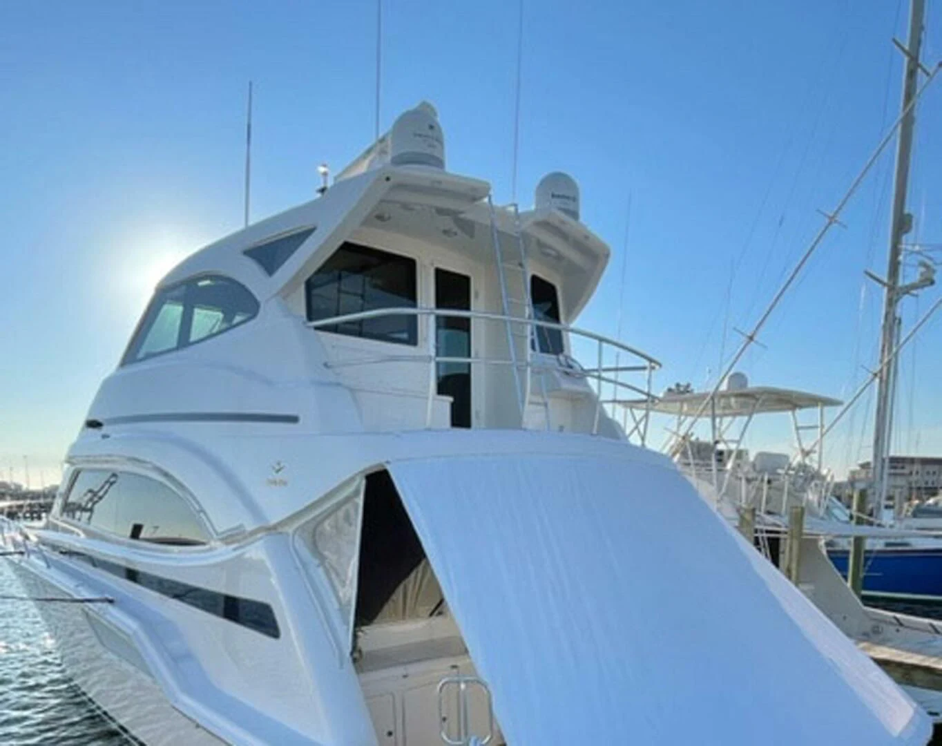 a white boat docked aboard REEL BUSY Yacht for Sale