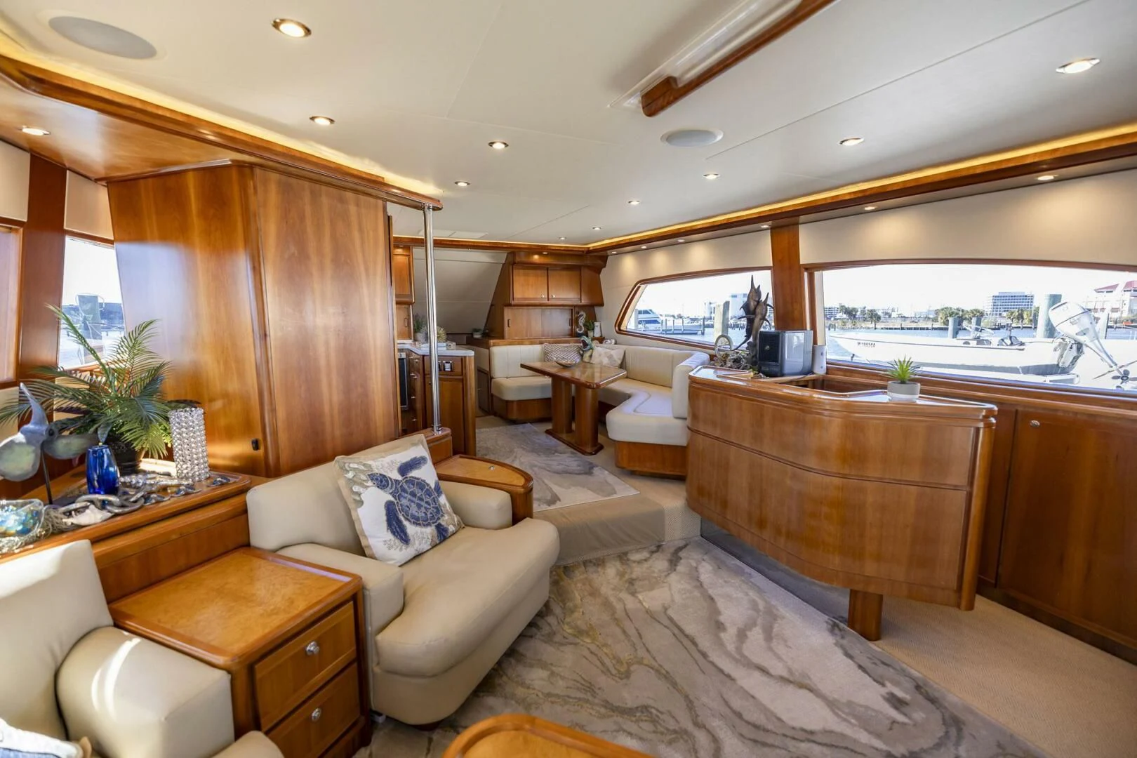 a living room with a kitchen and a dining room aboard REEL BUSY Yacht for Sale