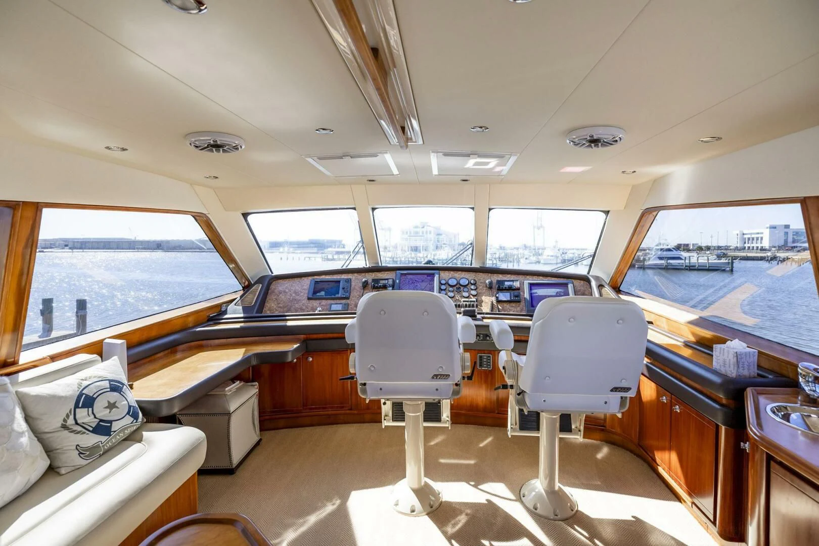 inside of a vehicle with a view of the water and the deck aboard REEL BUSY Yacht for Sale