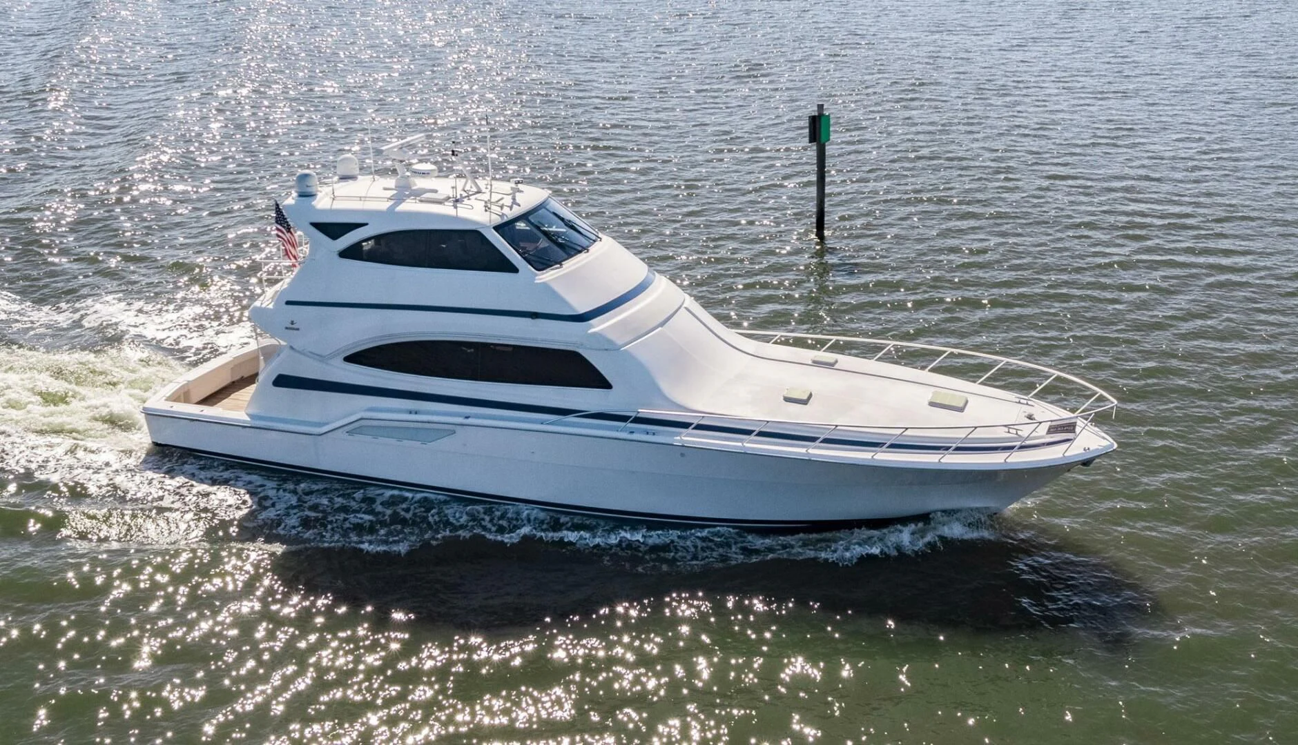 a white boat in the water aboard REEL BUSY Yacht for Sale