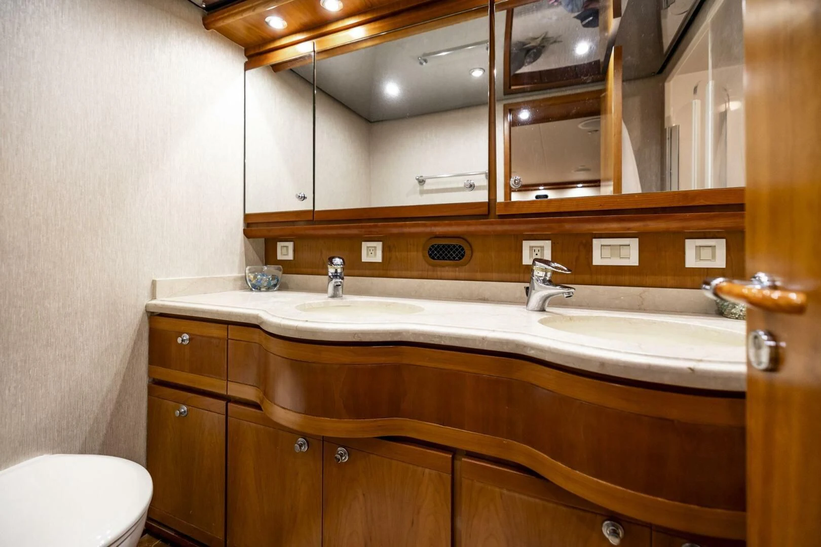 a bathroom with a large mirror aboard REEL BUSY Yacht for Sale