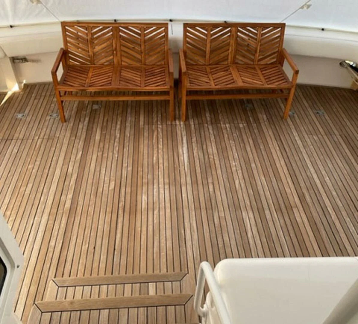 a wooden bench on a deck aboard REEL BUSY Yacht for Sale