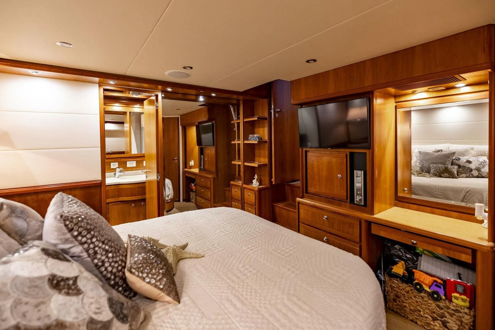 a bedroom with a bed and a television aboard REEL BUSY Yacht for Sale