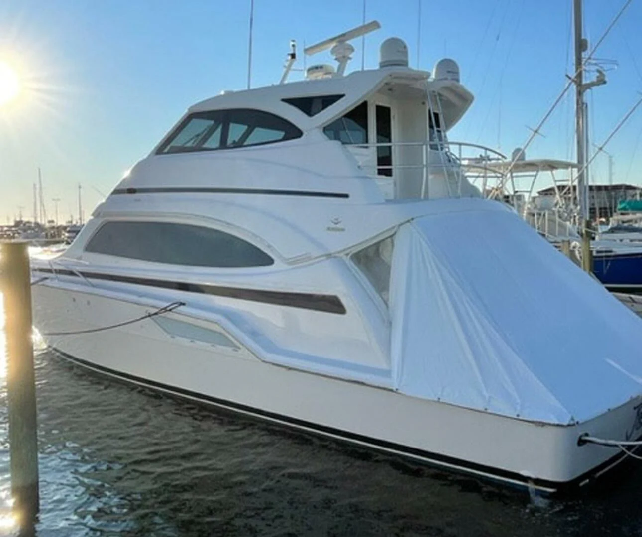 a white boat on the water aboard REEL BUSY Yacht for Sale
