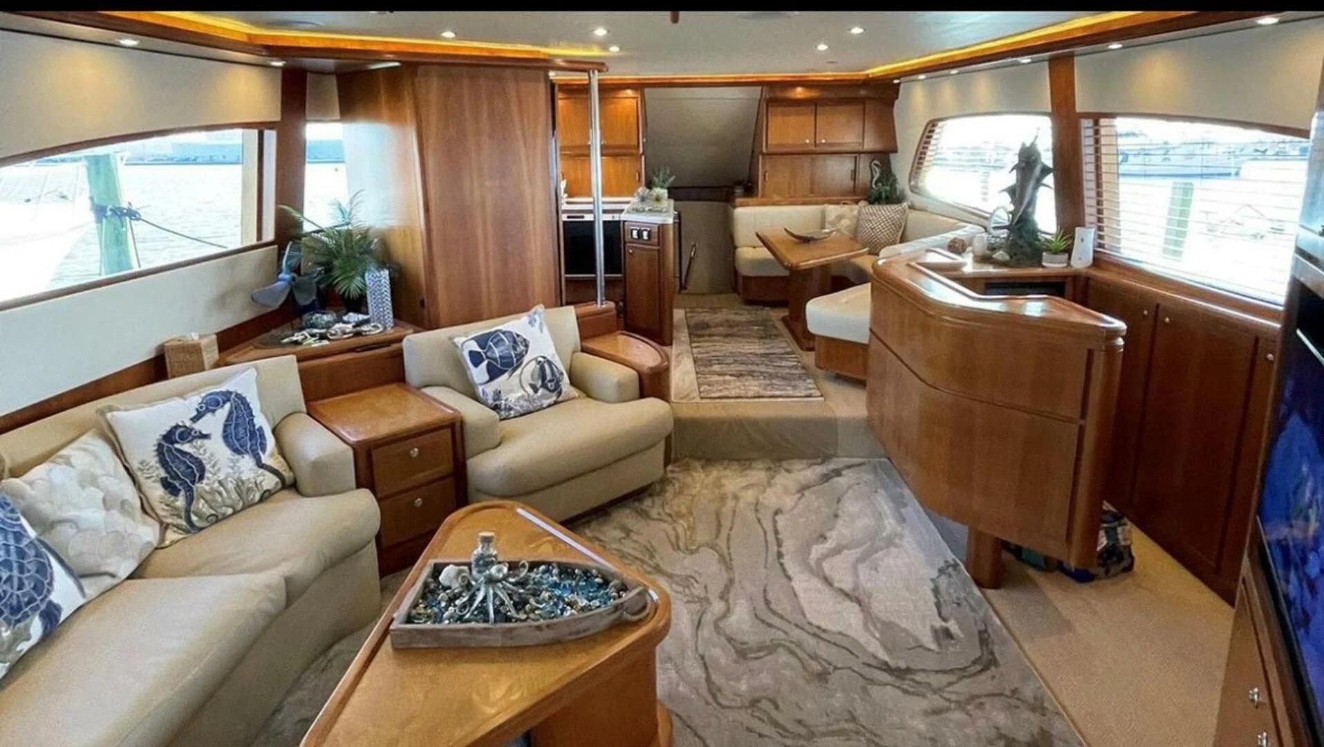 a living room with a large window aboard REEL BUSY Yacht for Sale