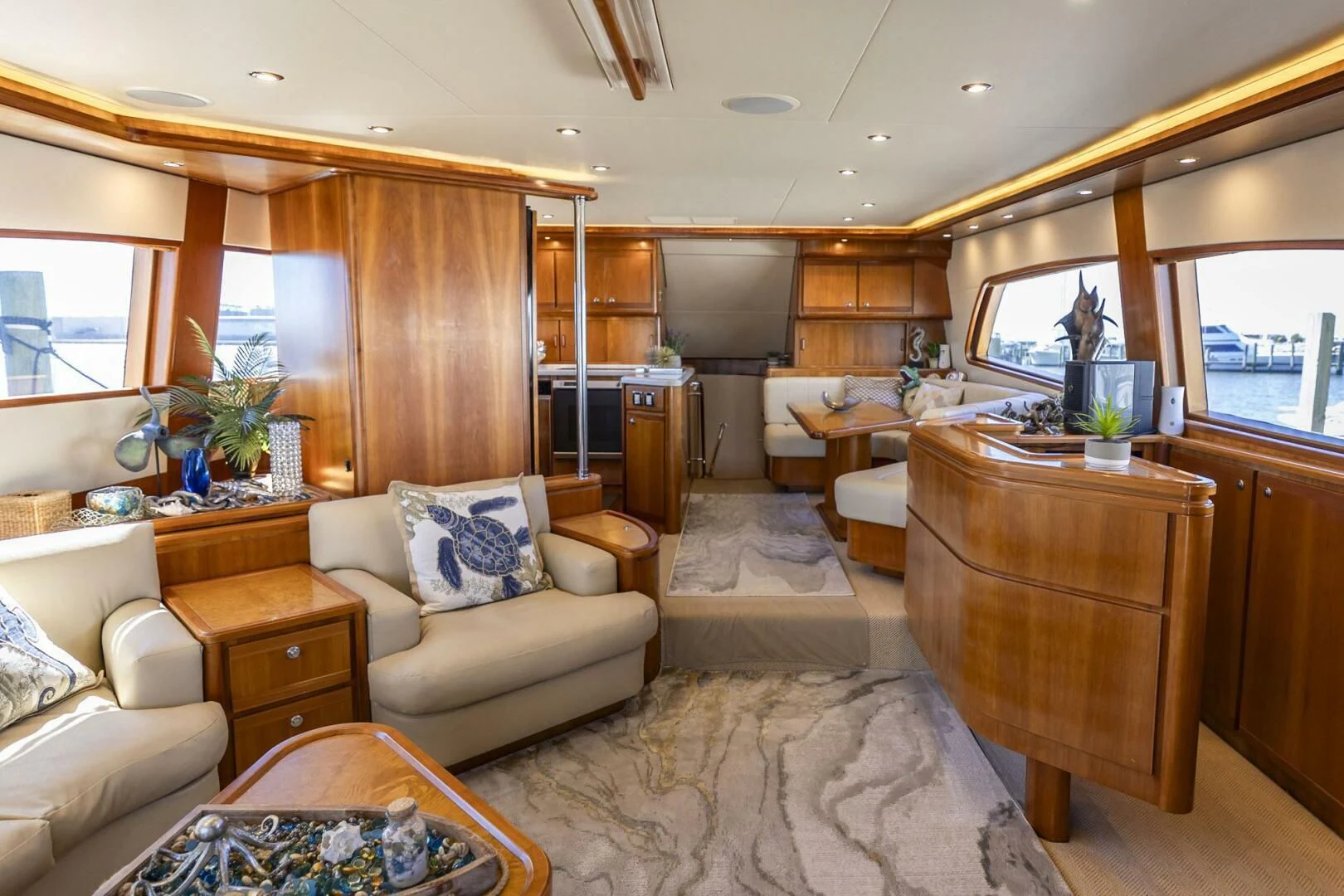 a living room with wood walls aboard REEL BUSY Yacht for Sale