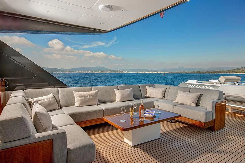 a living room with a large body of water aboard JANGADA Yacht for Sale