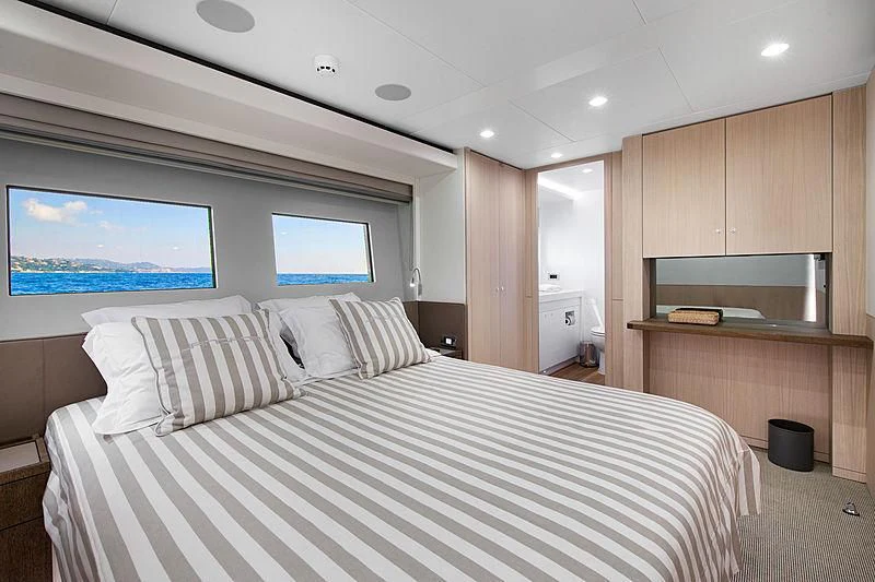 a large bedroom with a large bed aboard JANGADA Yacht for Sale