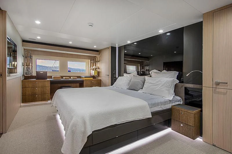 a bedroom with a bed aboard JANGADA Yacht for Sale